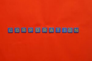 Blue tiles spelling 'corporation' on a bold red background, concept art.